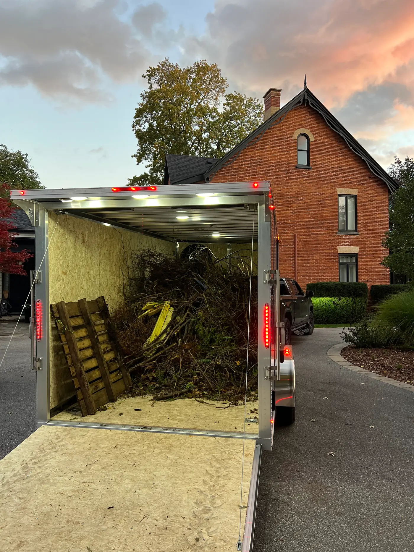 Trailer loaded with branches and yard debris ready to haul away